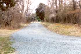 The trail becomes a gravel driveway.