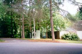 The trail crosses the driveway into the Ridge Heights Pool parking lot.