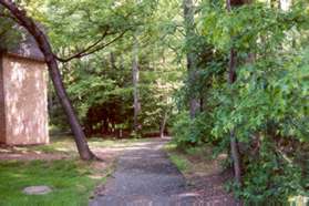 Follow the asphalt trail  through the trees behind the apartments.