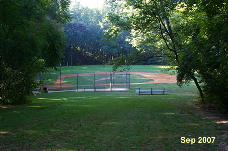 Turn right at the edge of the baseball field.