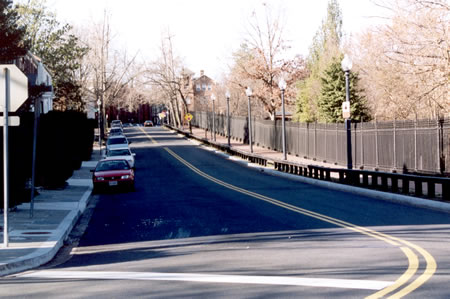 Turn left at the end of the road and follow the sidewalk along R St.