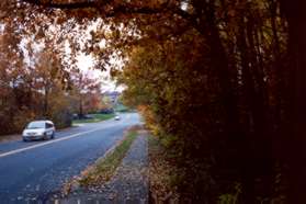 Turn right and follow the sidewalk at the next road intersection (Follin La).