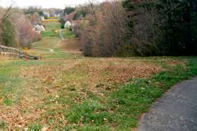 Turn left onto the path following the petroleum pipeline.