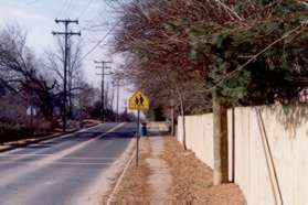 Turn right and follow the sidewalk along Malcomb st.