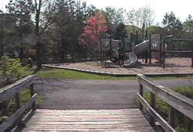 After crossing the bridge take the path to the right at the play area.