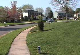 Upon reaching the first street (Darius Ln) turn right and follow the sidewalk to the end of that street.