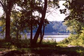 The trail returns to the river where the walk started.