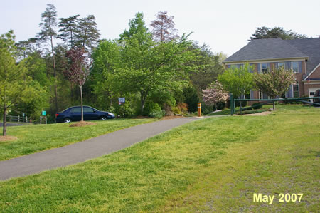 The trail intersects with Bare Island Dr. Cross that street turning slightly to the left.