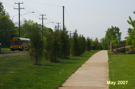 Turn right to follow the sidewalk along that road.