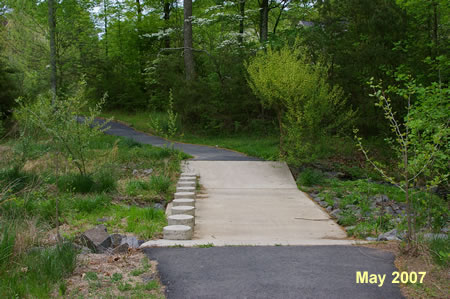 The trail crosses a stream on columns. The stream is usually dry.