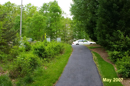 The trail intersects with Northbourne Dr. Turn left onto the sidewalk.