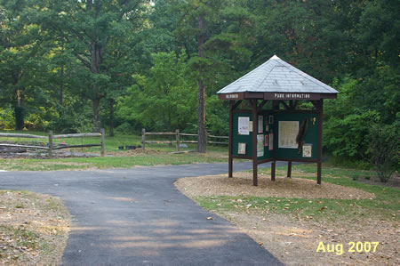 Turn right onto the asphalt trail by the display area.