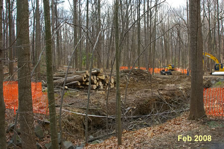 The old bridge is gone in the Feb. picture, the new bridge is shown in the Apr. picture.