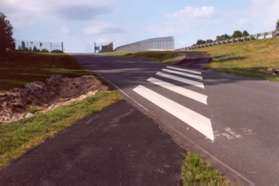 The trail crosses Holly Knoll Dr.  Stay on the asphalt trail.