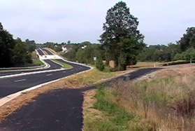 The asphalt trail follows Wiehle Av.  Do not take the trail branching to the right to Rowland Dr.