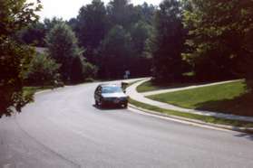 The short trail leads to Lake Newport Rd.  Cross that street and turn left up the hill on the sidewalk.