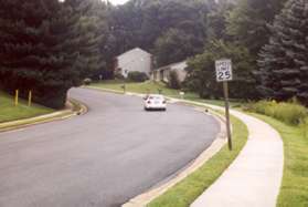 Turn right and follow the sidewalk east along Ring Road.