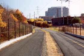 The trail crosses Town Center Pwy on a bridge.  Notice the construction on the right during a recession.