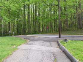 After some distance the trail crosses an access road to the dog park. Continue on the asphalt trail on the other side of the road.